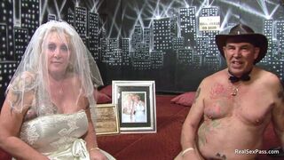 Post-wedding, older bride and younger maid of honor share intimate moments